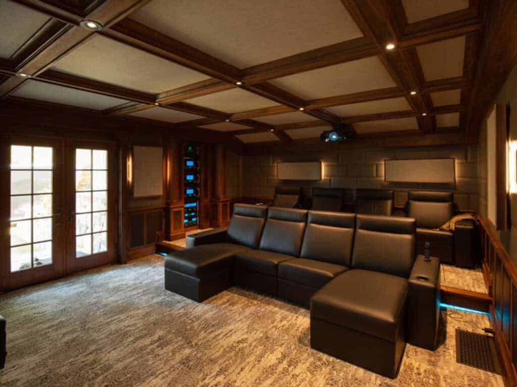 Elegant home theater with leather seating and ambient lighting by Atlantic AV.