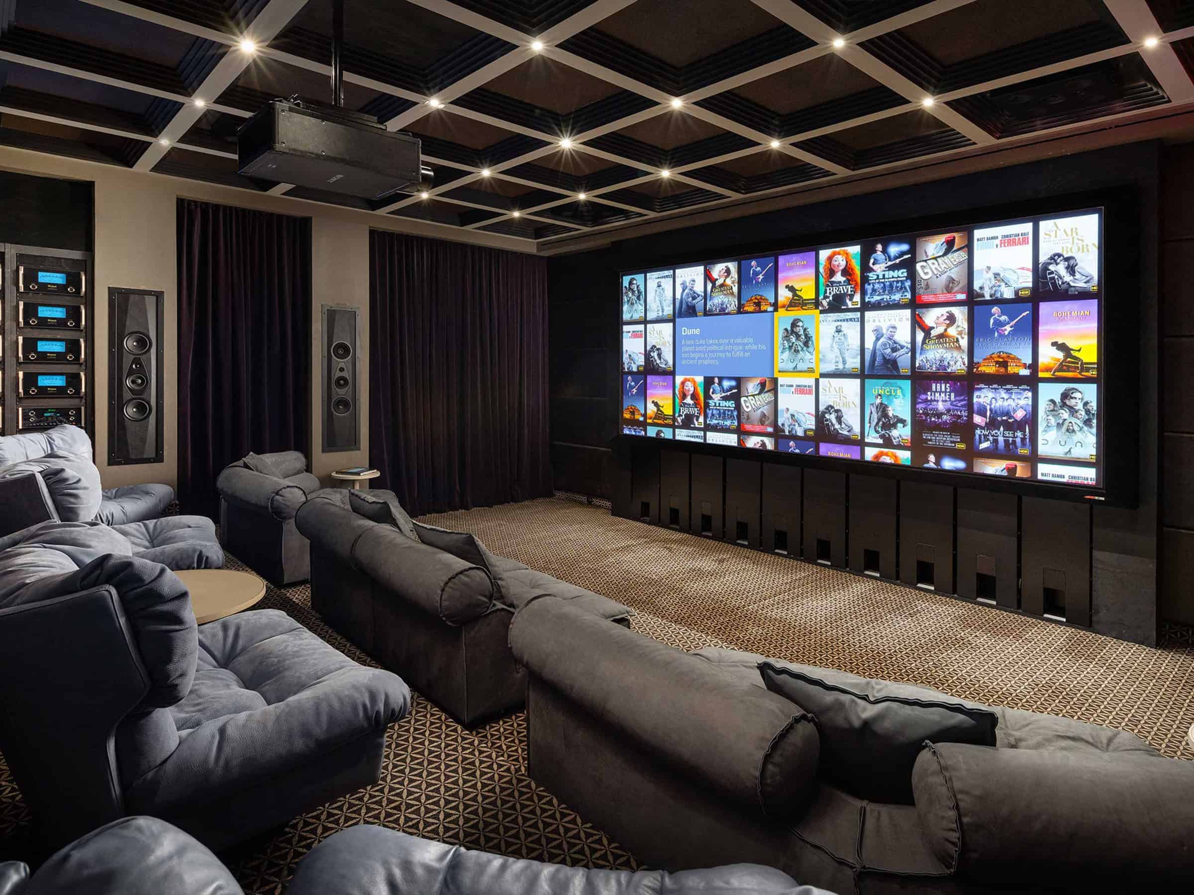 Luxury home theater with large screen and surround sound by Atlantic AV.