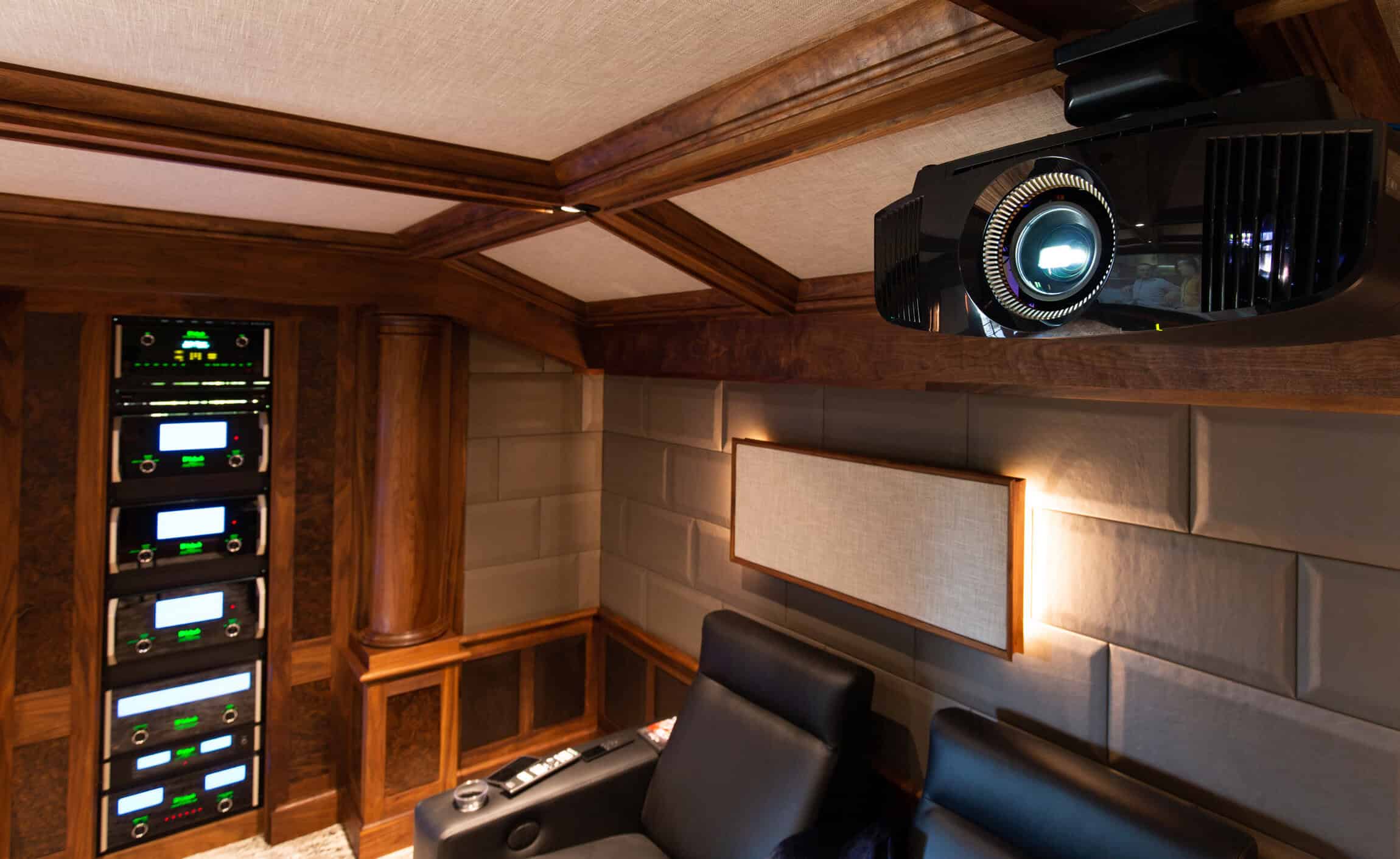 High-quality home theater setup with projector, sound system, and seating by Atlantic AV.